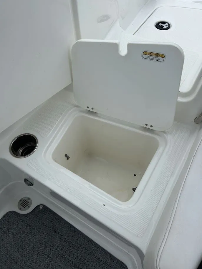 Slide: The Image of Open storage compartment on a 2019 Tahoe 2150 boat. - 25