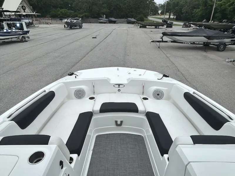 Slide: The Image of Interior view of a 2019 Tahoe 2150 boat on a parking lot. - 7