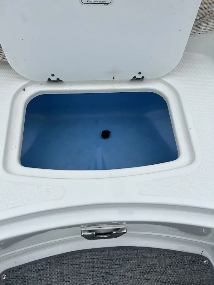Slide: The Image of Open storage compartment in 2019 Tahoe 2150 boat. - 8