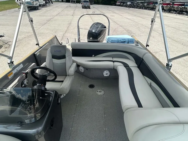 Slide: The Image of Interior of a 2018 Lowe Sport Deck 224 boat with seating area. - 10