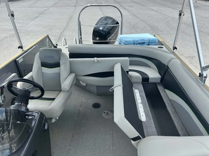 Slide: The Image of Interior of a 2018 Lowe Sport Deck 224 boat with gray seating. - 11