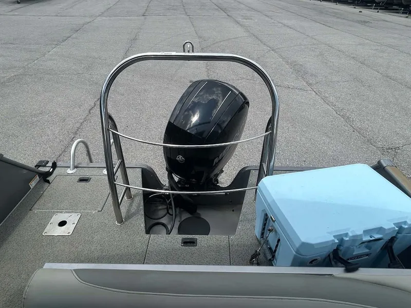 Slide: The Image of Rear view of a 2018 Lowe Sport Deck 224 boat with outboard motor. - 12