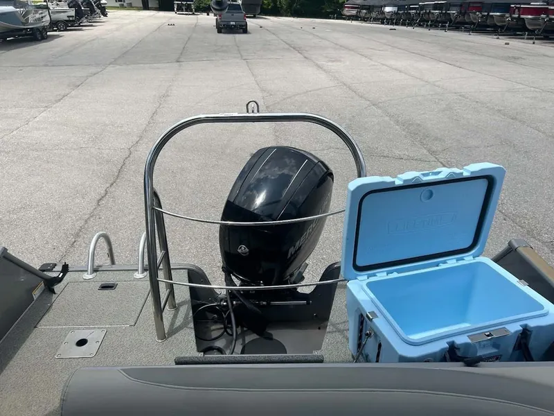 Slide: The Image of 2018 Lowe Sport Deck 224 with outboard motor and cooler. - 13