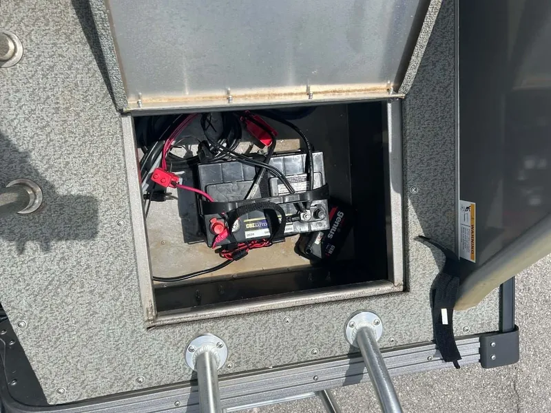 Slide: The Image of Battery compartment of a 2018 Lowe Sport Deck 224 boat. - 15