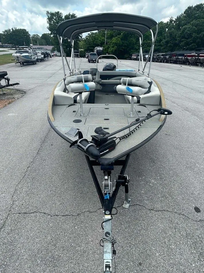 Slide: The Image of 2018 Lowe Sport Deck 224 boat on trailer, gray upholstery. - 4