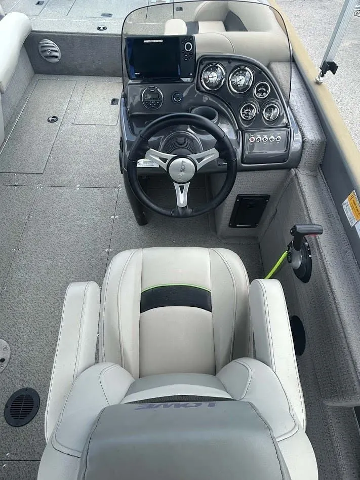 Slide: The Image of Interior view of 2018 Lowe Sport Deck 224 boat cockpit. - 5