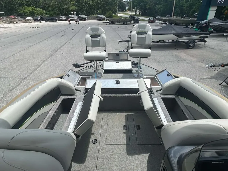 Slide: The Image of Interior view of a 2018 Lowe Sport Deck 224 boat with seating and storage. - 6