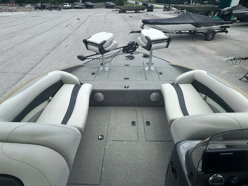 Slide: The Image of 2018 Lowe Sport Deck 224 boat with seating area and helm console. - 7