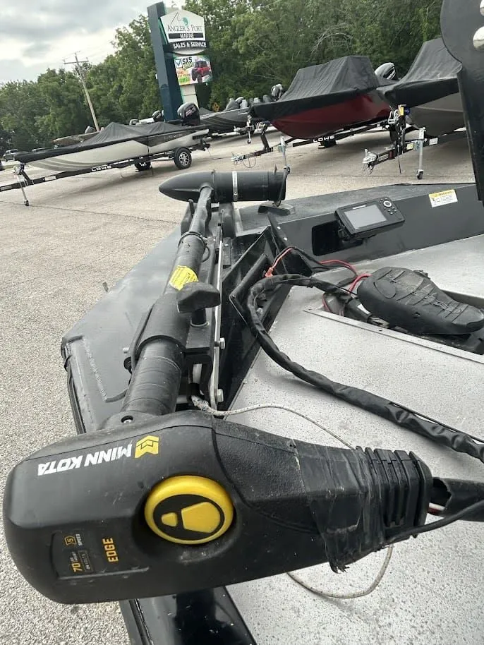 Slide: The Image of 2020 Stinger 175C boat with Minn Kota motor in parking lot. - 11