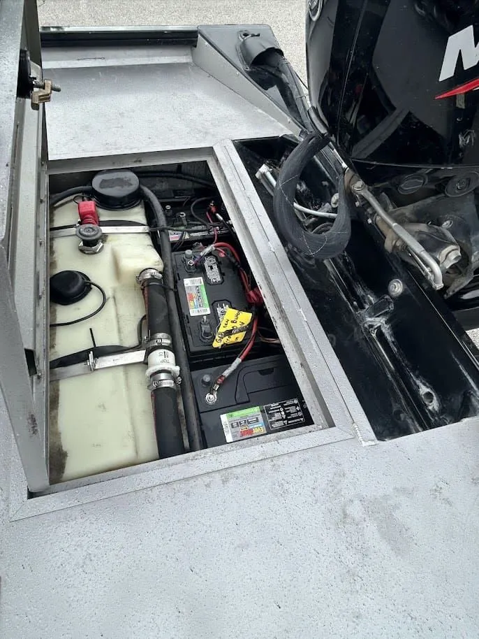 Slide: The Image of Battery compartment of a 2020 Stinger 175C boat with engine. - 17