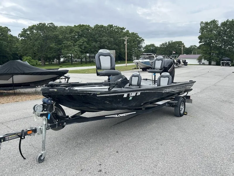 Slide: The Image of Black 2020 Stinger 175C boat parked on trailer. - 5