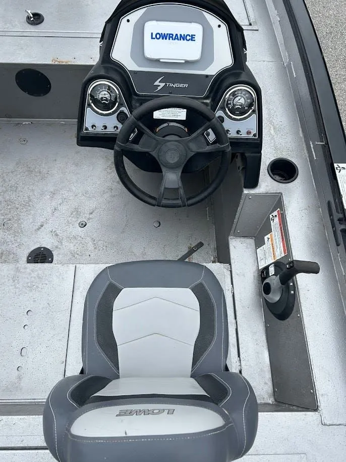 Slide: The Image of Interior view of a 2020 Stinger 175C boat with Lowrance controls. - 7