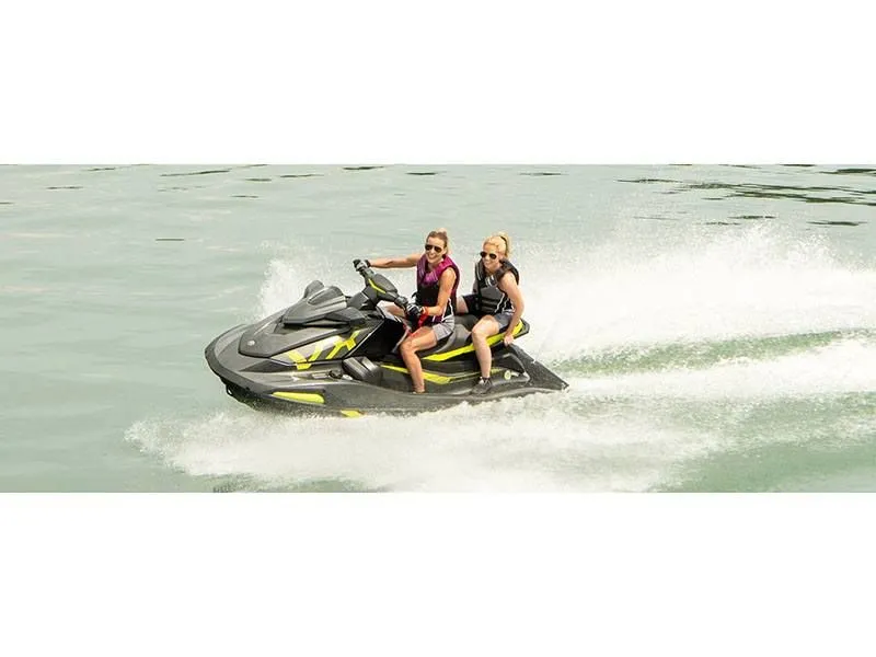 Slide: The Image of Two people riding 2022 Yamaha VX Deluxe jet ski on water. - 11