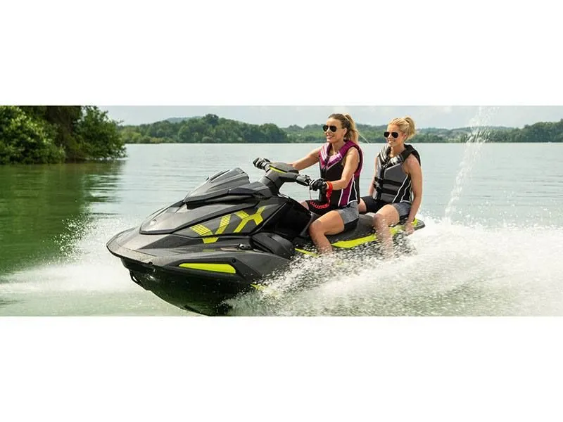 Slide: The Image of Two people riding 2022 Yamaha VX Deluxe jet ski on a lake. - 7