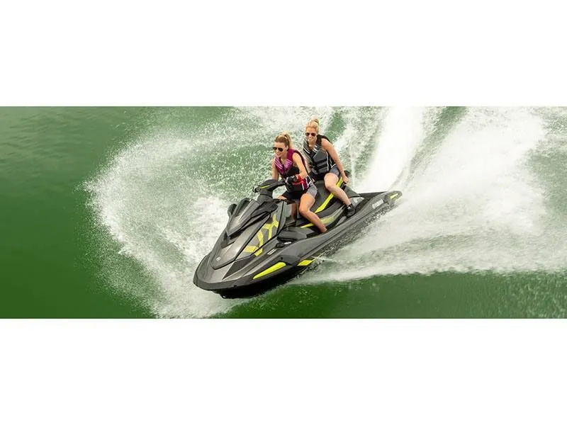 Slide: The Image of Two people riding 2022 Yamaha VX Deluxe jet ski on green water. - 9