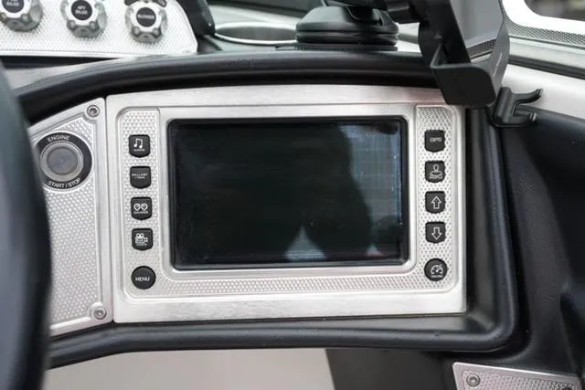 Slide: The Image of Dashboard of a 2015 MasterCraft X20 boat with control panel and display screen. - 18