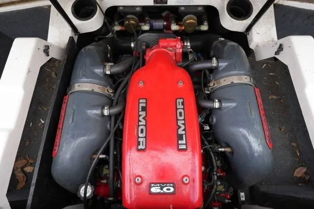 Slide: The Image of 2015 MasterCraft X20 Ilmor MV8 6.0 engine, red and gray components, top view. - 21