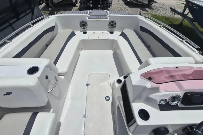Slide: The Image of 2022 Starcraft SVX 171 OB boat interior with spacious seating and modern dashboard. - 13
