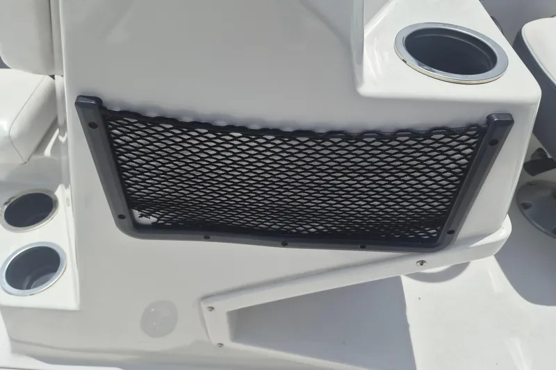 Slide: The Image of 2022 Starcraft SVX 171 OB boat interior with cup holders and storage netting. - 14