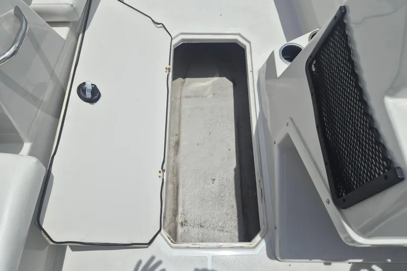 Slide: The Image of Open storage compartment on 2022 Starcraft SVX 171 OB boat deck. - 15