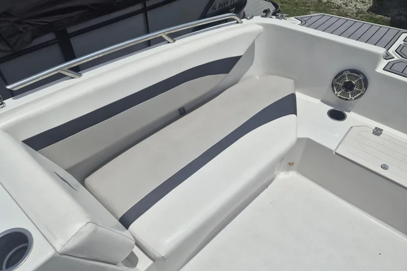 Slide: The Image of 2022 Starcraft SVX 171 OB boat interior with cushioned seating and speaker. - 17