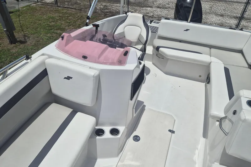 Slide: The Image of 2022 Starcraft SVX 171 OB boat interior with white seating and pink windshield. - 21