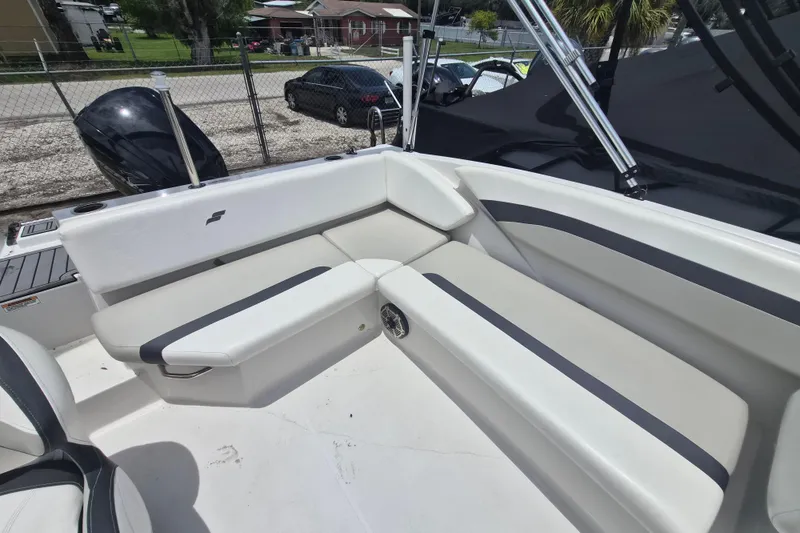 Slide: The Image of 2022 Starcraft SVX 171 OB boat interior with white seating and black accents. - 7