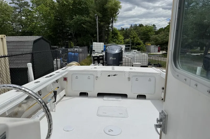 Slide: The Image of 2016 Steiger Craft 25 Chesapeake boat with Yamaha 250 engine, docked outdoors. - 12