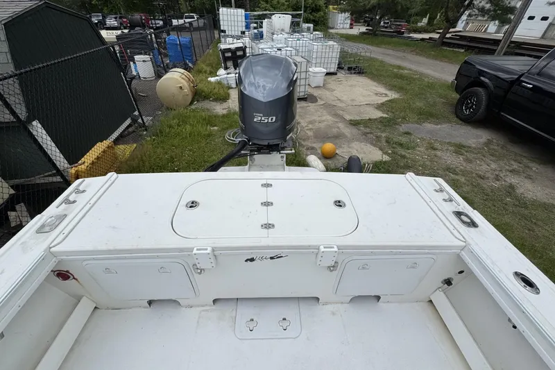 Slide: The Image of 2016 Steiger Craft 25 Chesapeake boat with Yamaha 250 engine, docked outdoors. - 16