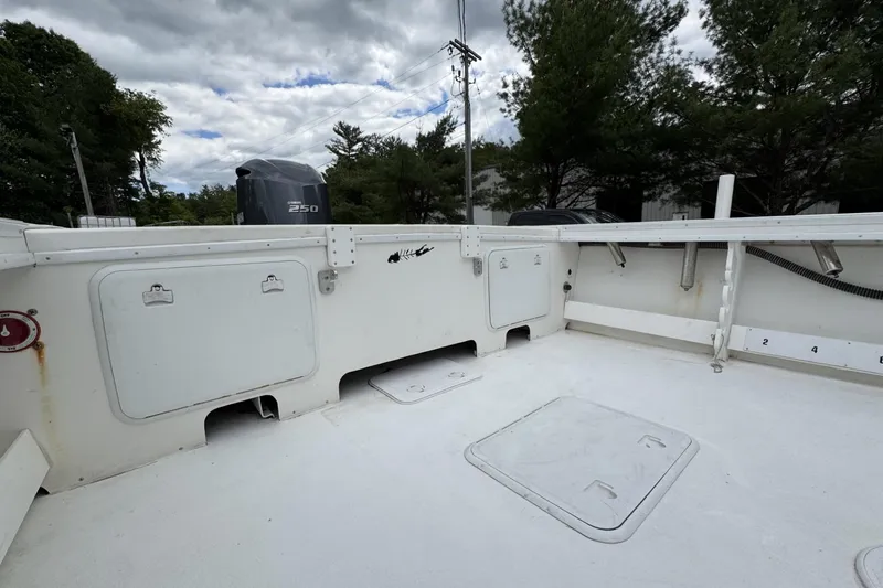 Slide: The Image of 2016 Steiger Craft 25 Chesapeake boat deck with Yamaha 250 engine, under cloudy sky. - 17