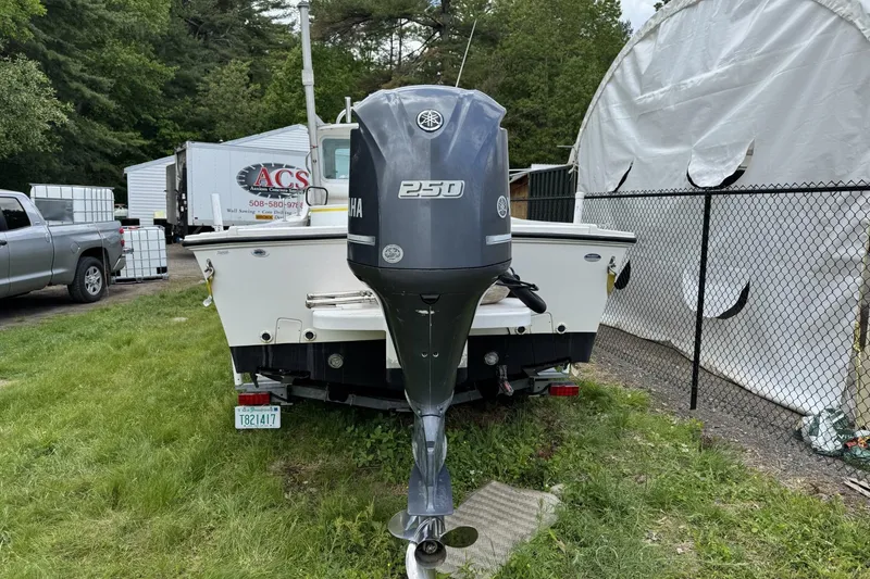 Slide: The Image of 2016 Steiger Craft 25 Chesapeake boat with Yamaha 250 outboard motor in a yard. - 3