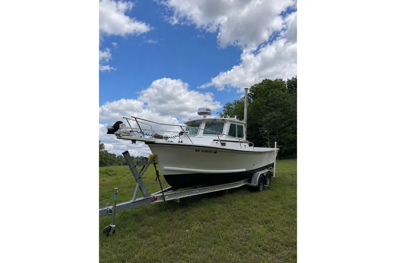 Slide: The Image of 2016 Steiger Craft 25 Chesapeake boat on trailer under blue sky. - 31