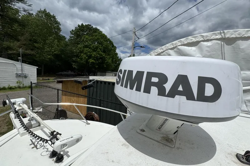 Slide: The Image of 2016 Steiger Craft 25 Chesapeake boat with Simrad radar system under cloudy sky. - 32