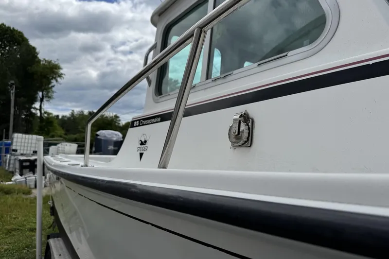 Slide: The Image of 2016 Steiger Craft 25 Chesapeake boat with railing, side view. - 5