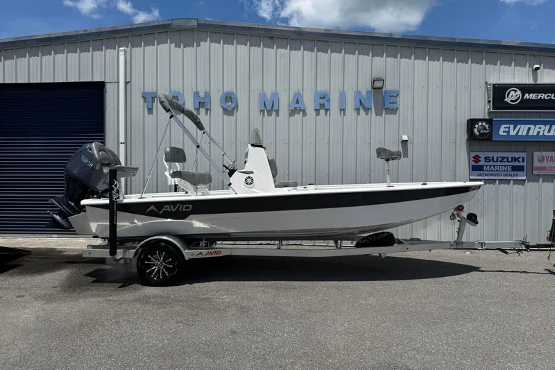 The Image of 2026 Avid 21 Mag boat on trailer at Toho Marine dealership. - 1