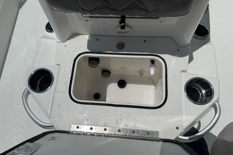Slide: The Image of Interior view of 2026 Avid 21 Mag boat, featuring a built-in storage compartment. - 12