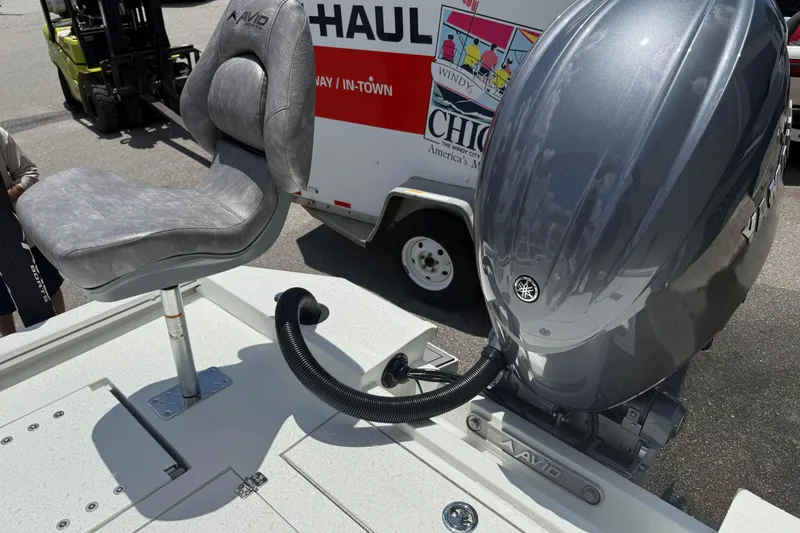 Slide: The Image of Avid 21 Mag boat with Yamaha outboard motor and cushioned seat, 2026 model. - 19