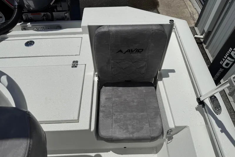 Slide: The Image of Avid 21 Mag 2026 boat seat with gray upholstery and logo, showcasing modern design. - 20