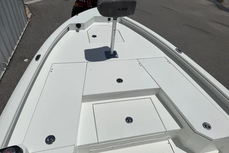 Slide: The Image of 2026 Avid 21 Mag boat deck with storage compartments and seating. - 7
