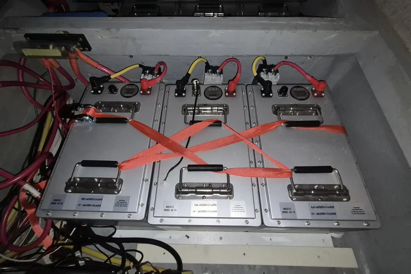 Slide: The Image of Battery compartment of a 2009 Endeavour 40 Skylounge with secured wiring and connections. - 19