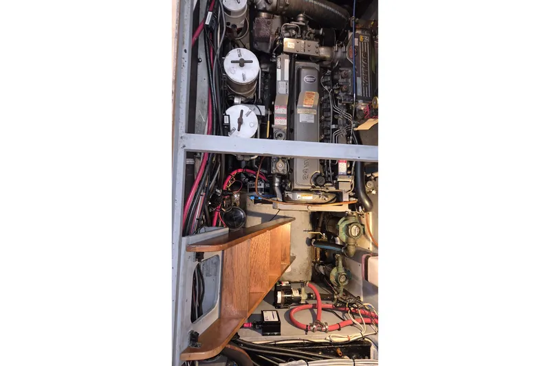 Slide: The Image of Engine compartment of 2009 Endeavour 40 Skylounge yacht, showcasing mechanical components and wiring. - 21