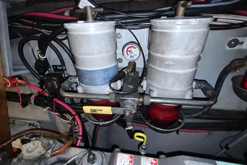 Slide: The Image of Engine compartment of 2009 Endeavour 40 Skylounge with fuel filter system and wiring. - 22