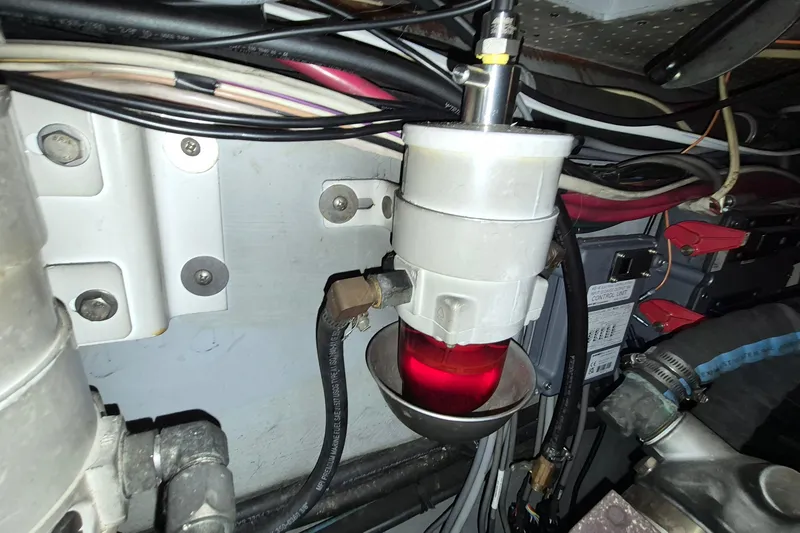 Slide: The Image of Engine compartment of 2009 Endeavour 40 Skylounge with fuel filter and wiring. - 23