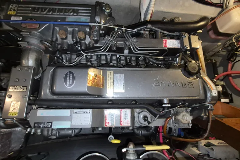 Slide: The Image of Engine of a 2009 Endeavour 40 Skylounge yacht, showcasing detailed mechanical components. - 25