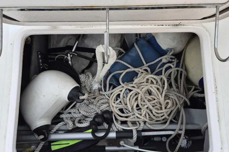 Slide: The Image of Storage compartment on a 2009 Endeavour 40 Skylounge, filled with ropes and boat fenders. - 30