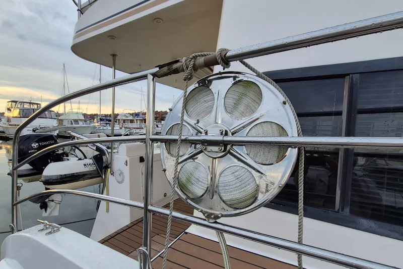 Slide: The Image of 2009 Endeavour 40 Skylounge yacht with docked boats and marine equipment. - 44