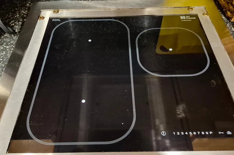 Slide: The Image of Induction cooktop on Endeavour 40 Skylounge yacht, 2009 model, with dual cooking zones. - 7