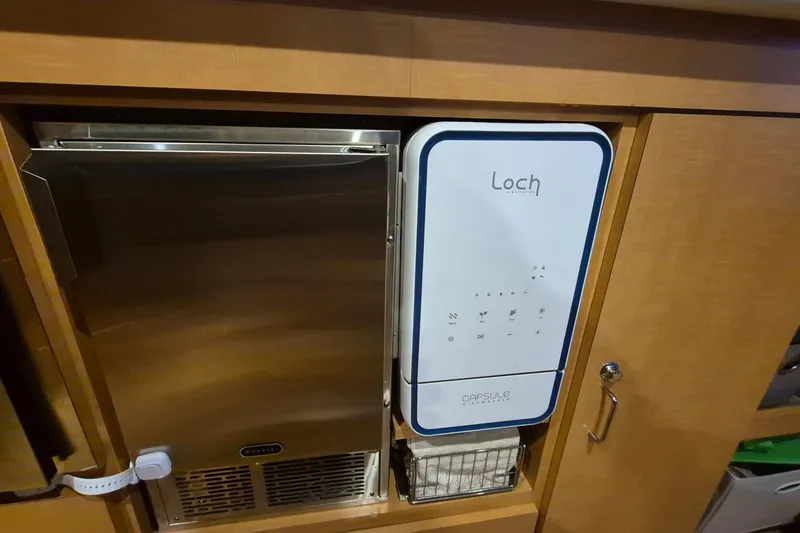 Slide: The Image of Built-in appliance setup on 2009 Endeavour 40 Skylounge yacht interior. - 9