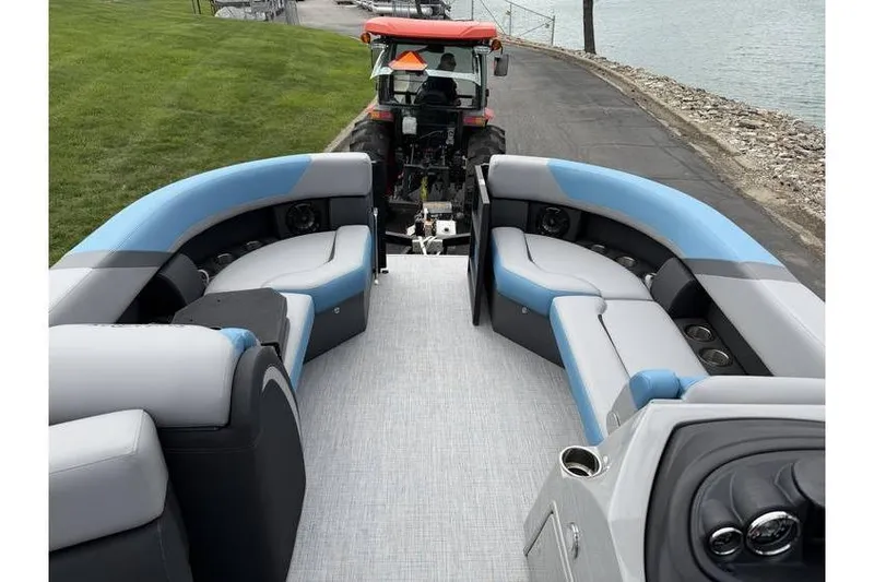 Slide: The Image of 2026 South Bay 224 RS 3.0 Hybrid Arch pontoon boat interior with blue and gray seating. - 13