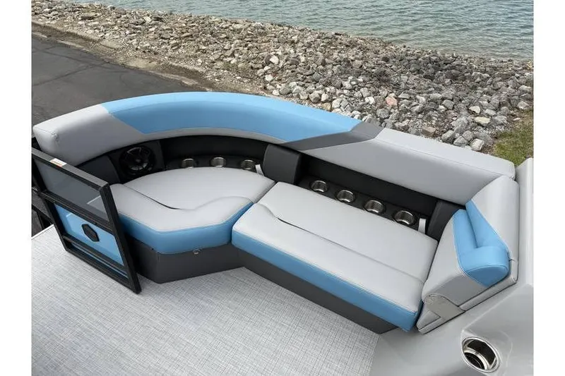 Slide: The Image of 2026 South Bay 224 RS 3.0 Hybrid Arch boat interior with blue and gray seating. - 14